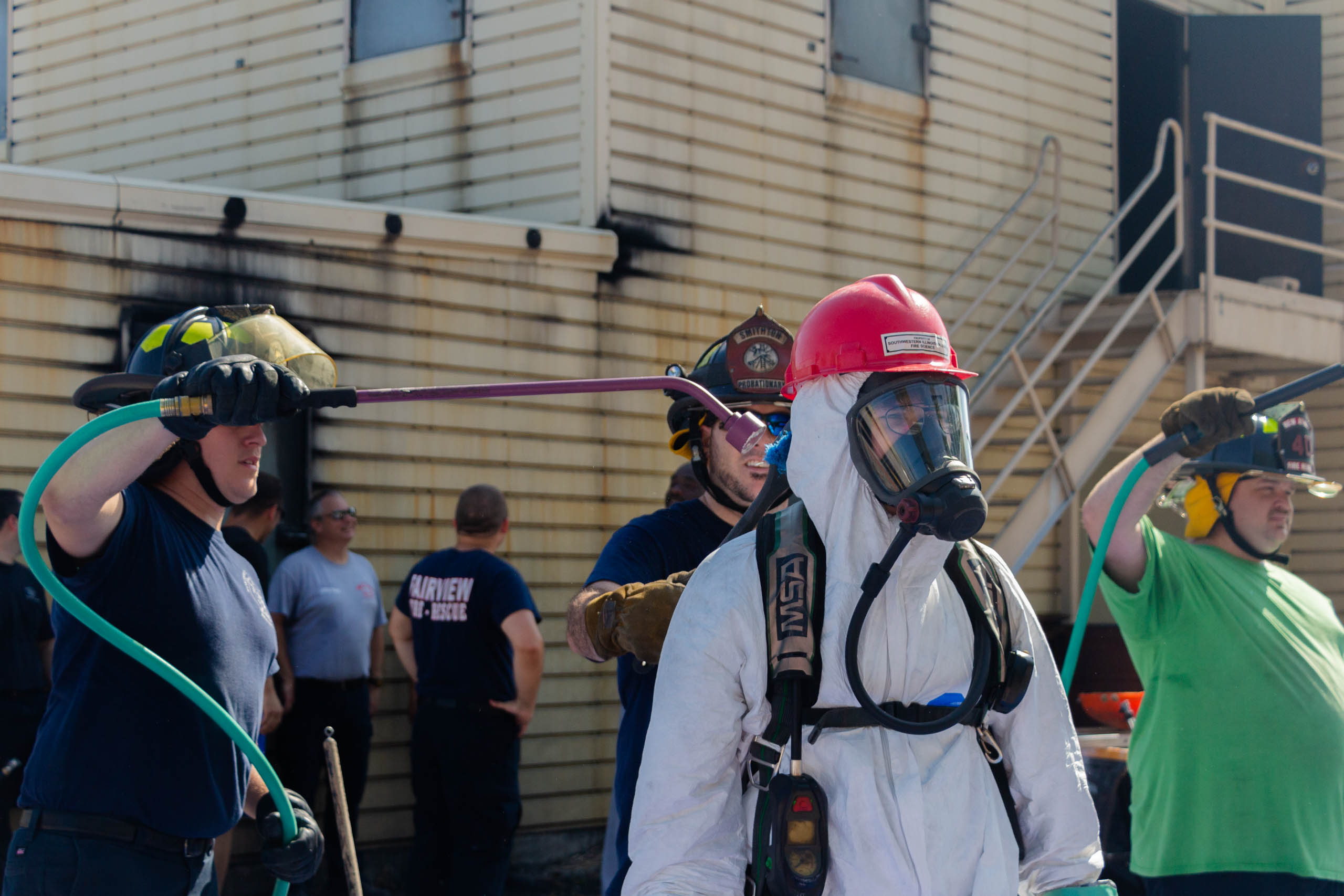 Fire Science Hazardous training person geared up having others teach different skills