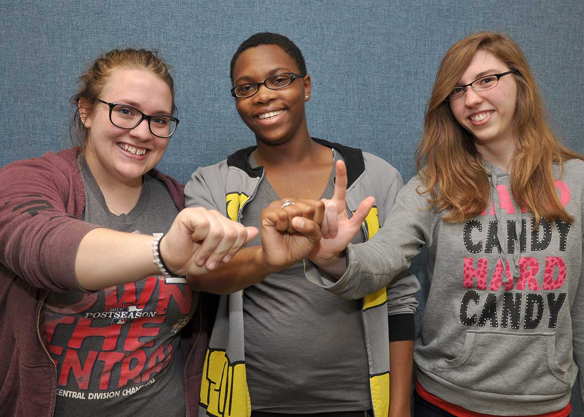 Students in American Sign language studies signing SWIC