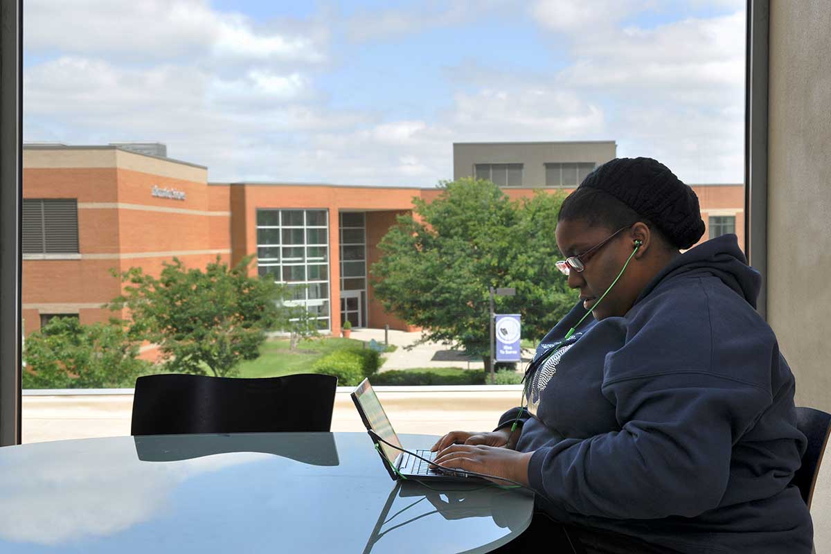 SWIC student working on a laptop