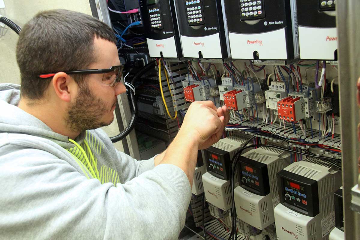 student working on industrial electronics