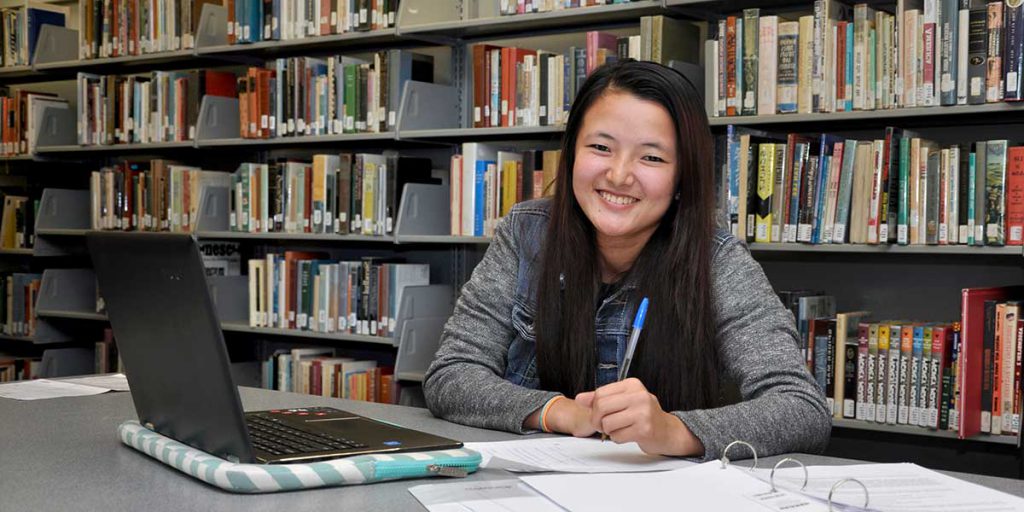 Library - girl with laptop