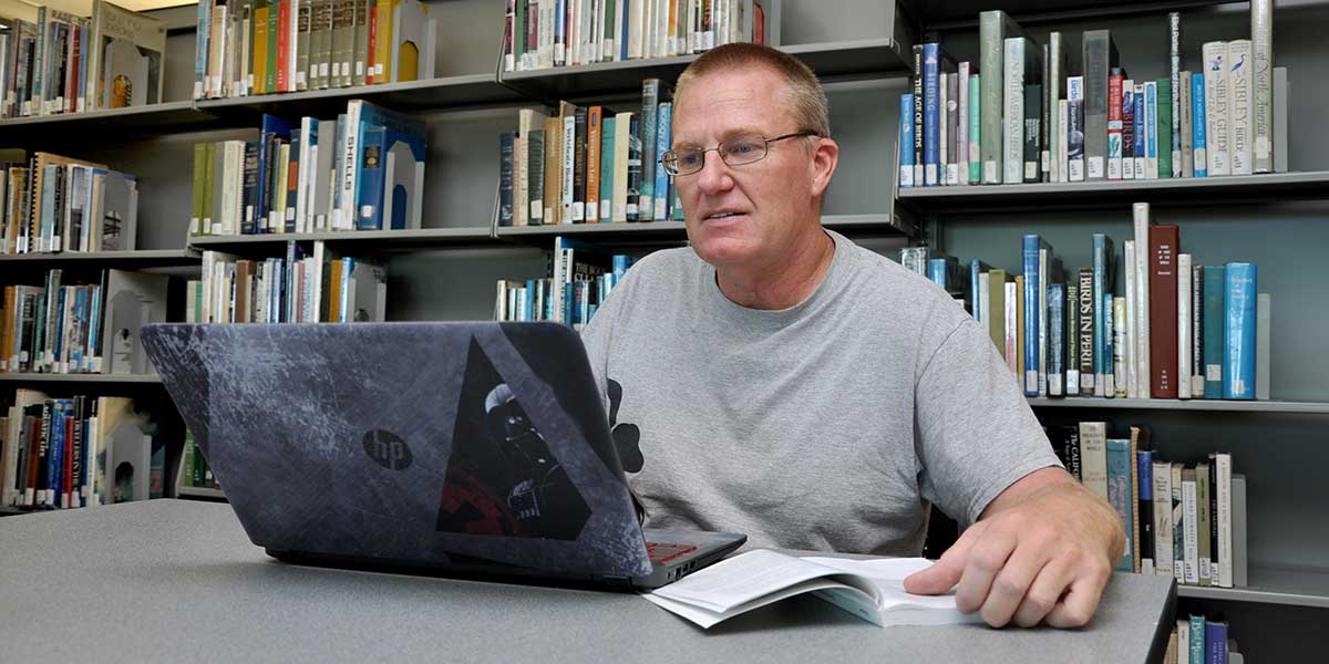 Library - man with laptop