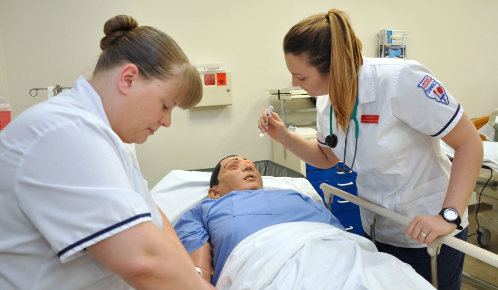 Nursing Education Students working with simulation model