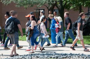 A group of students walking through the Belleville campus.