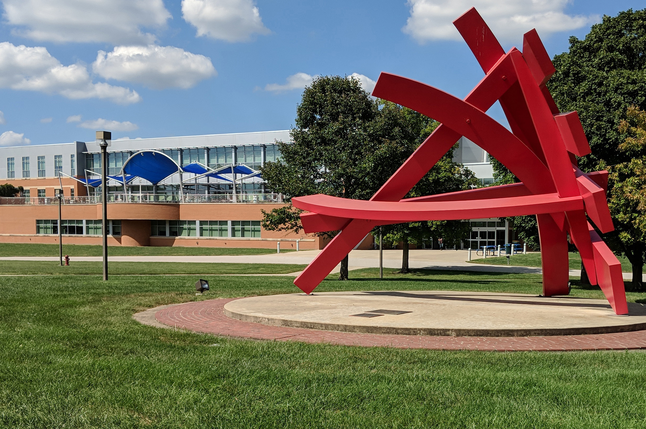 Photo of Michael Dunbar's "Astro Treillage" sculpture and the Liberal Arts building on the Belleville campus.