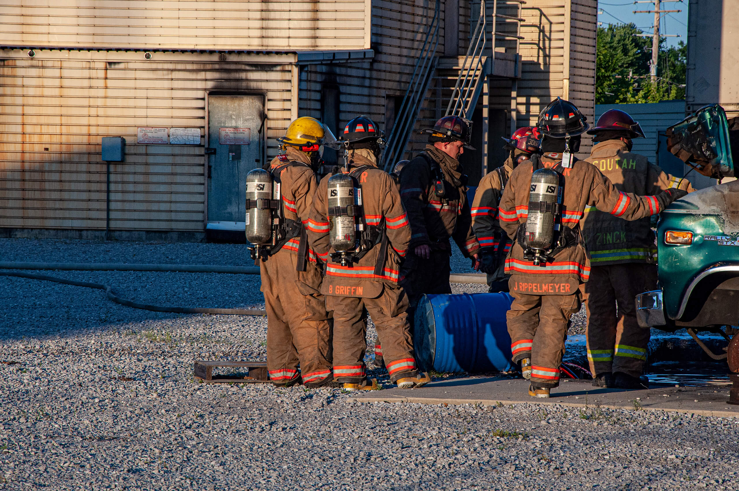 A group of firefighters preparing for a fire training exercise.