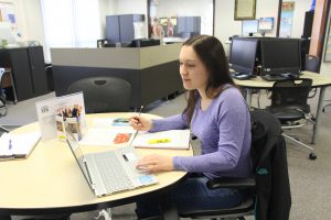 Red Bud Campus student working in the success center