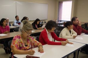 Photo of students working on an assignment in an English as a second language course.