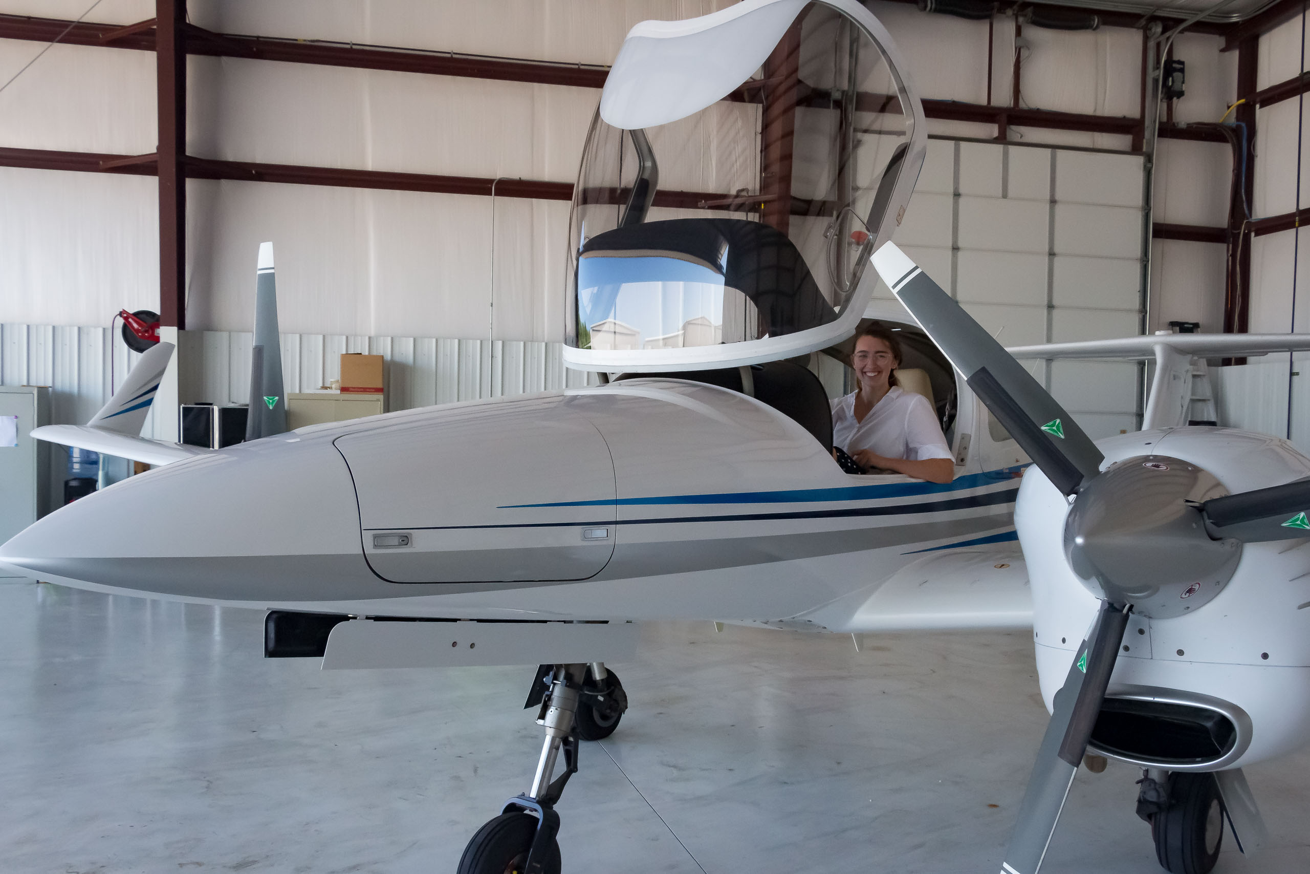 Student in cockpit of aircraft.