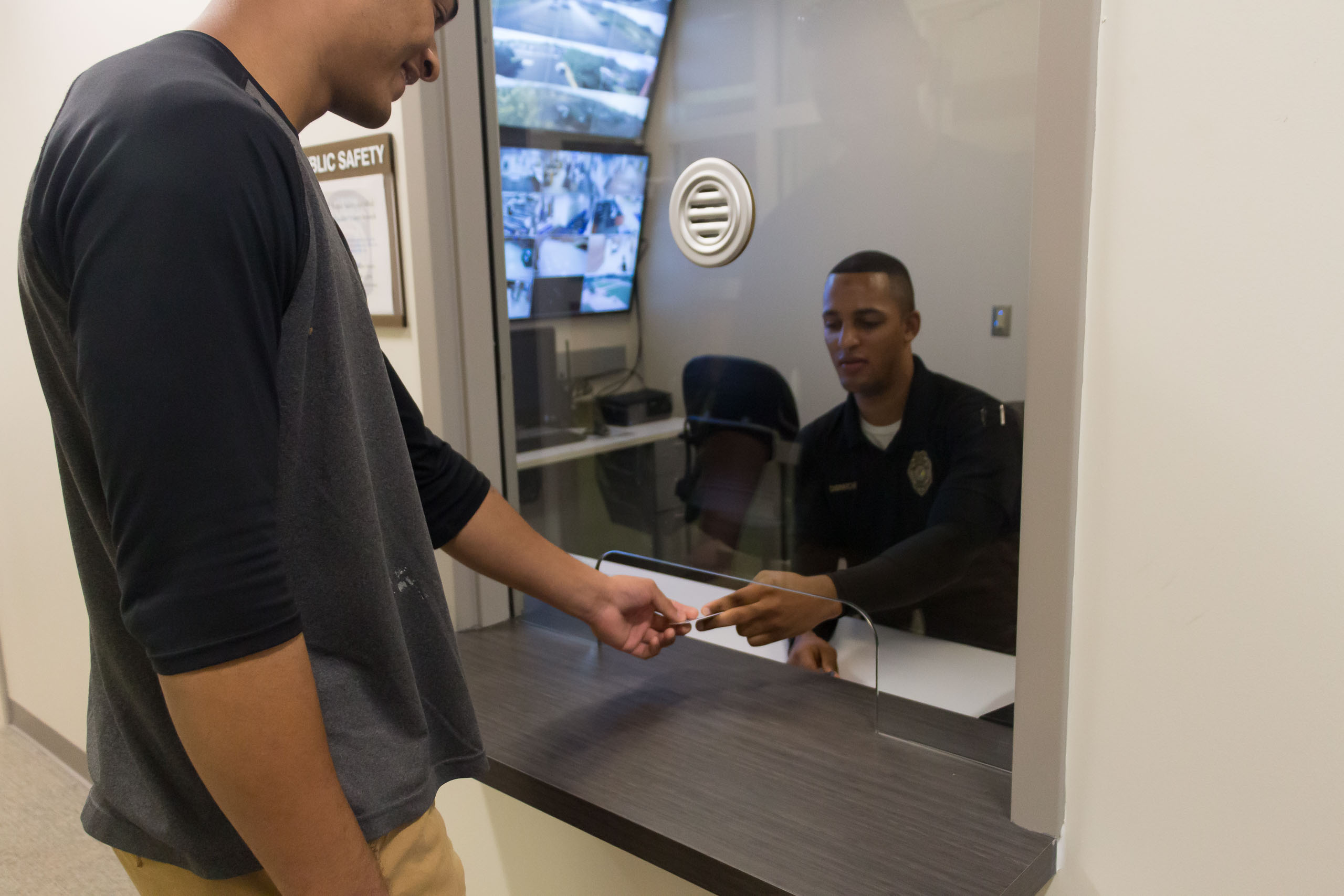 Officer giving student identification.