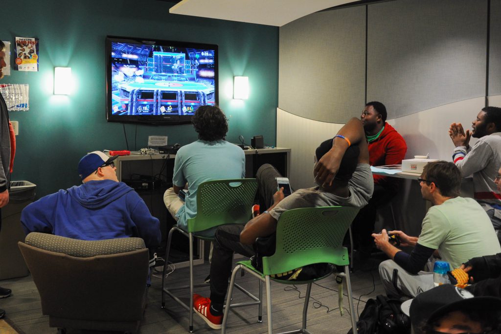 Students playing Super Smash Bros and enjoying their time in the Cyber Lounge.