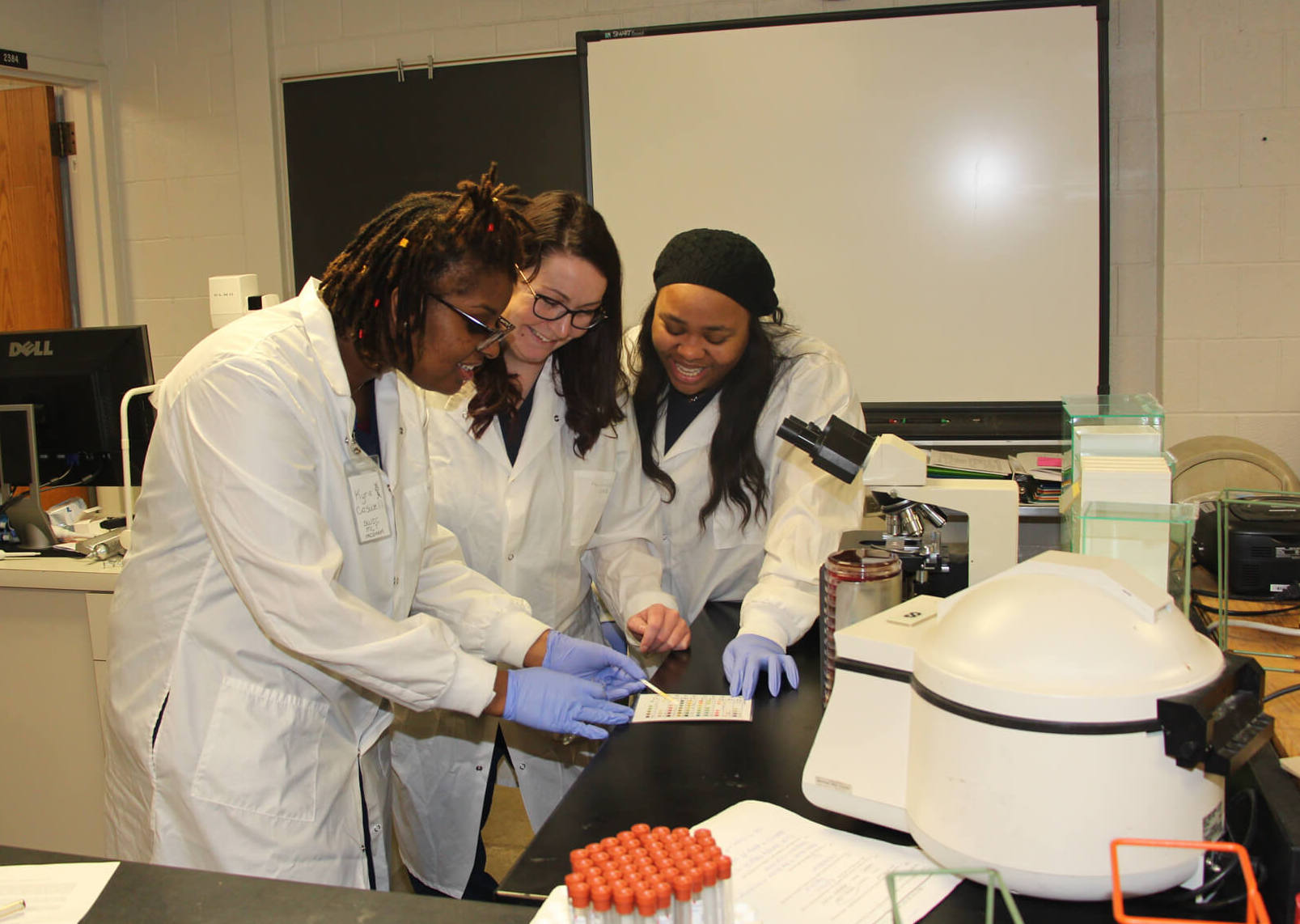 Southwestern Illinois College medical lab technician students work on a practical lab exercise.