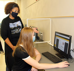 Southwestern Illinois College Associate Professor of English Chantay White-Williams, left, of St. Louis instructs Anastasia Ottinger of Shiloh during her English class. White-Williams was named Full-time Faculty Member of the Year for 2020 by the college Board of Trustees.