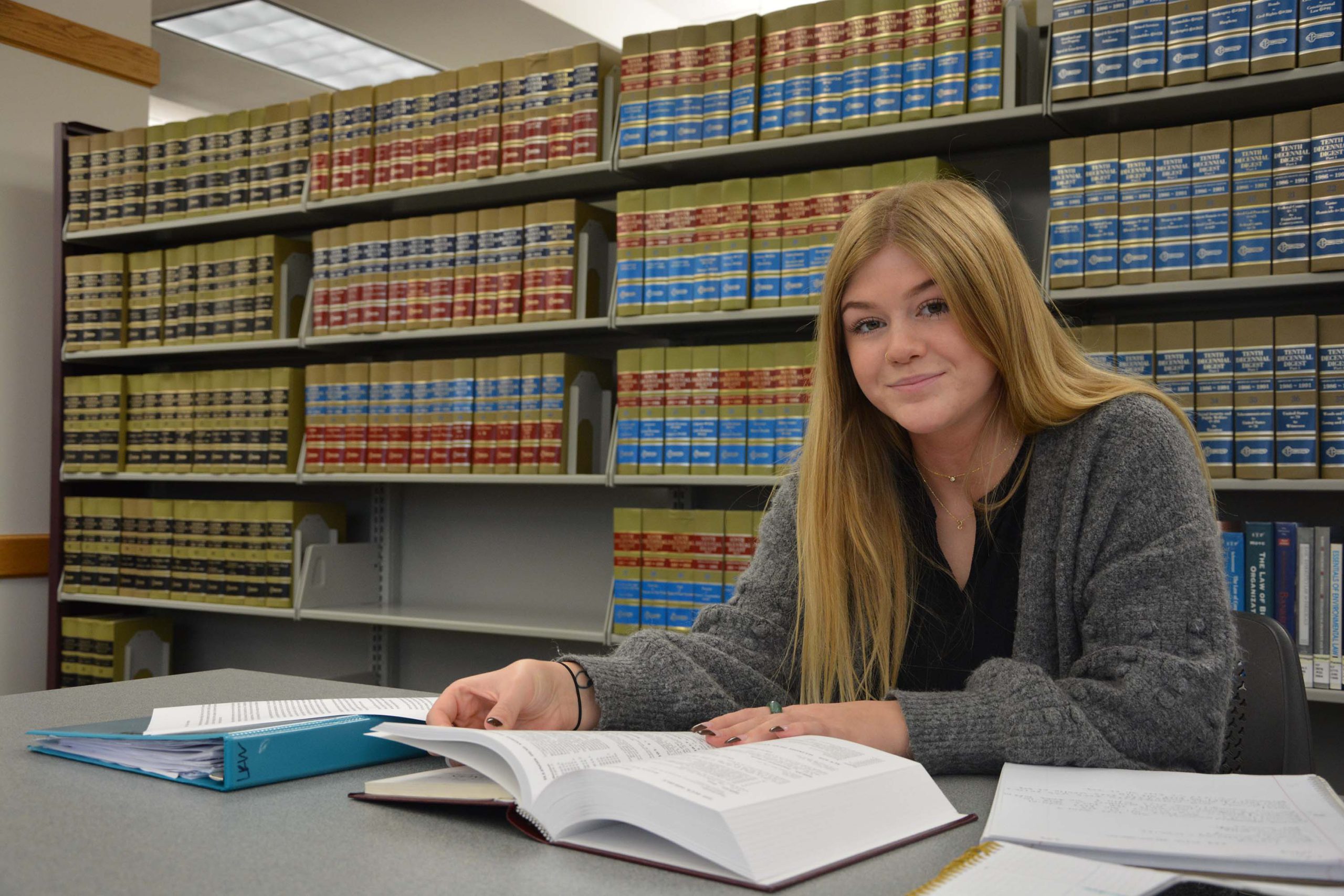 SWIC paralegal student studying in library