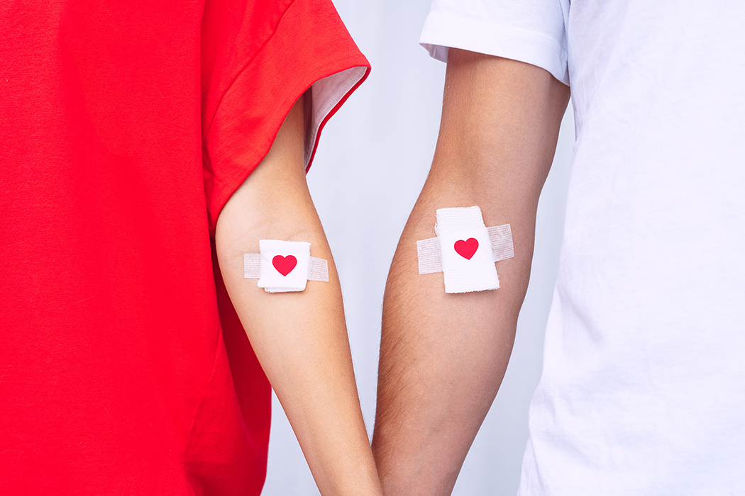 Blood donors with bandage after giving blood