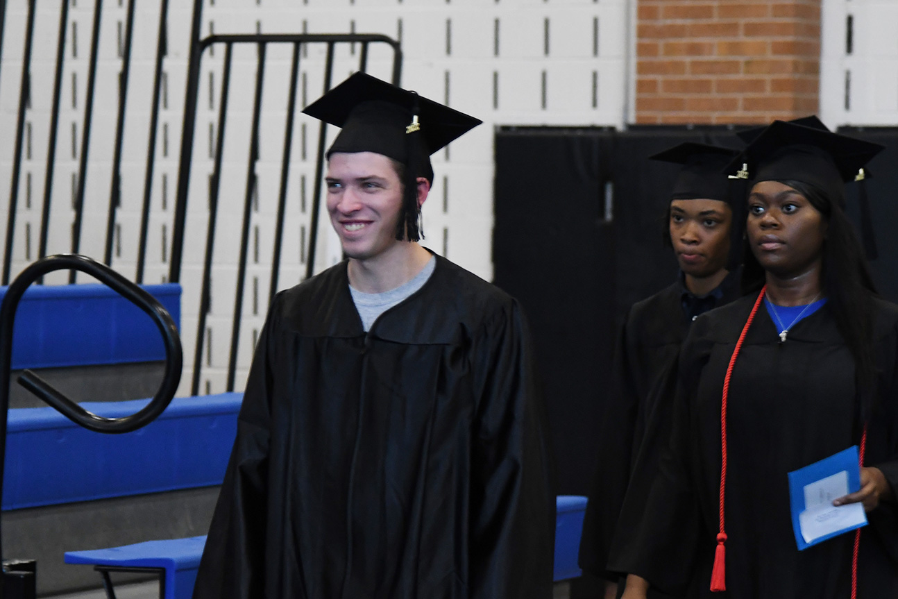 High School Equivalency and English as a Second Language graduation ceremony students participating in the graduation ceremony.