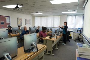 Adult Education Classroom with students and computers