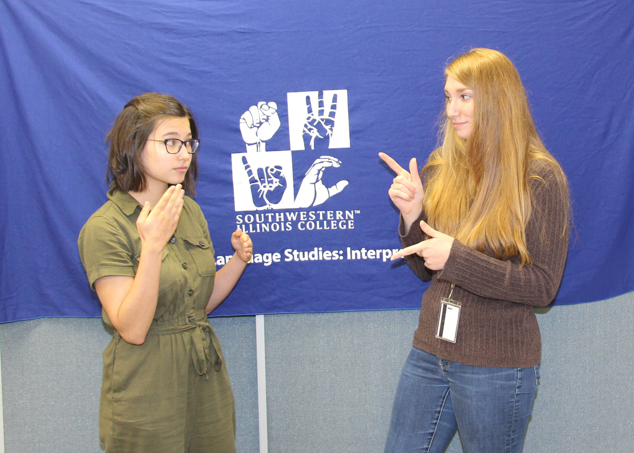 sign language students practicing with each other