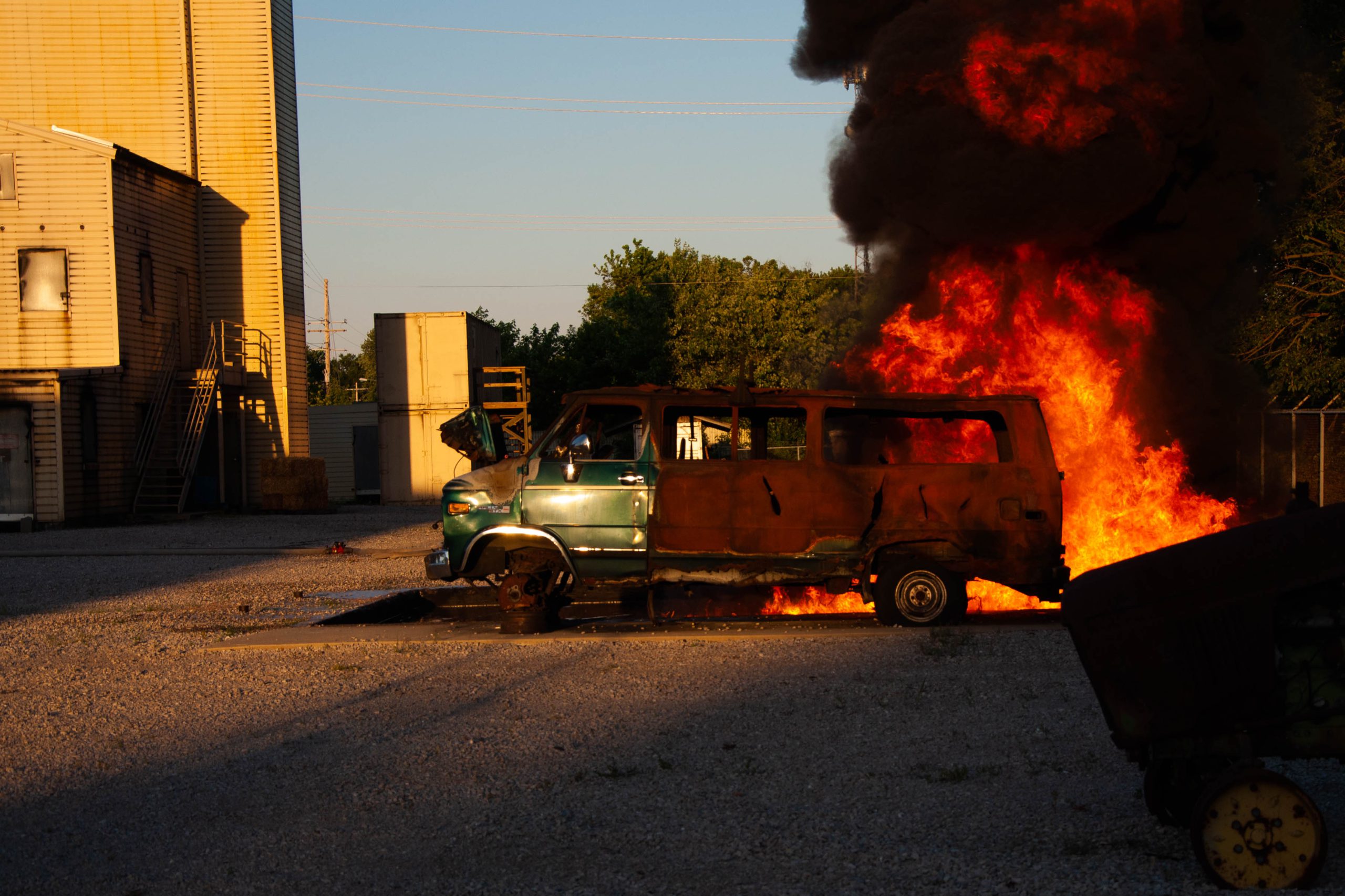 Hecker Fire Science training fire by a van