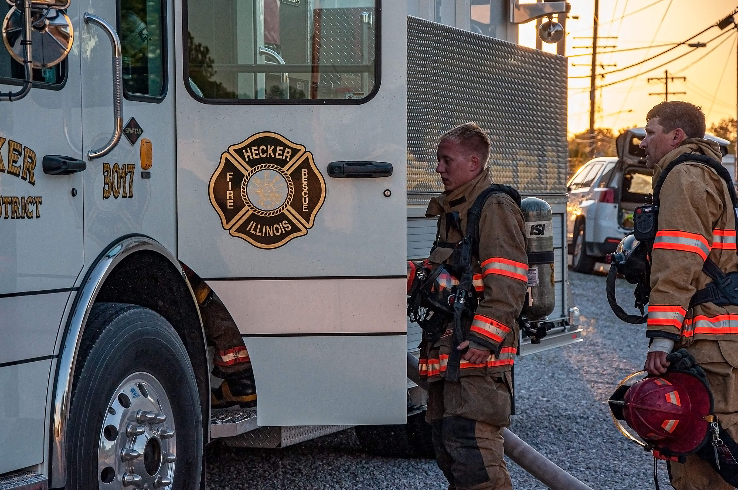 Hecker Fire Science training men in fire gear walking into fire truck