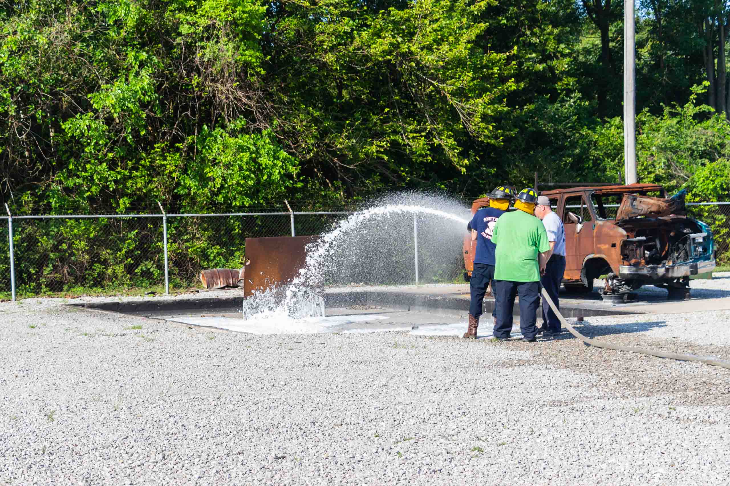 Fire Science Hazardous Materials training group of people training to use a hose. Example of an extenuating Circumstance for a FA Suspension Appeal Process.