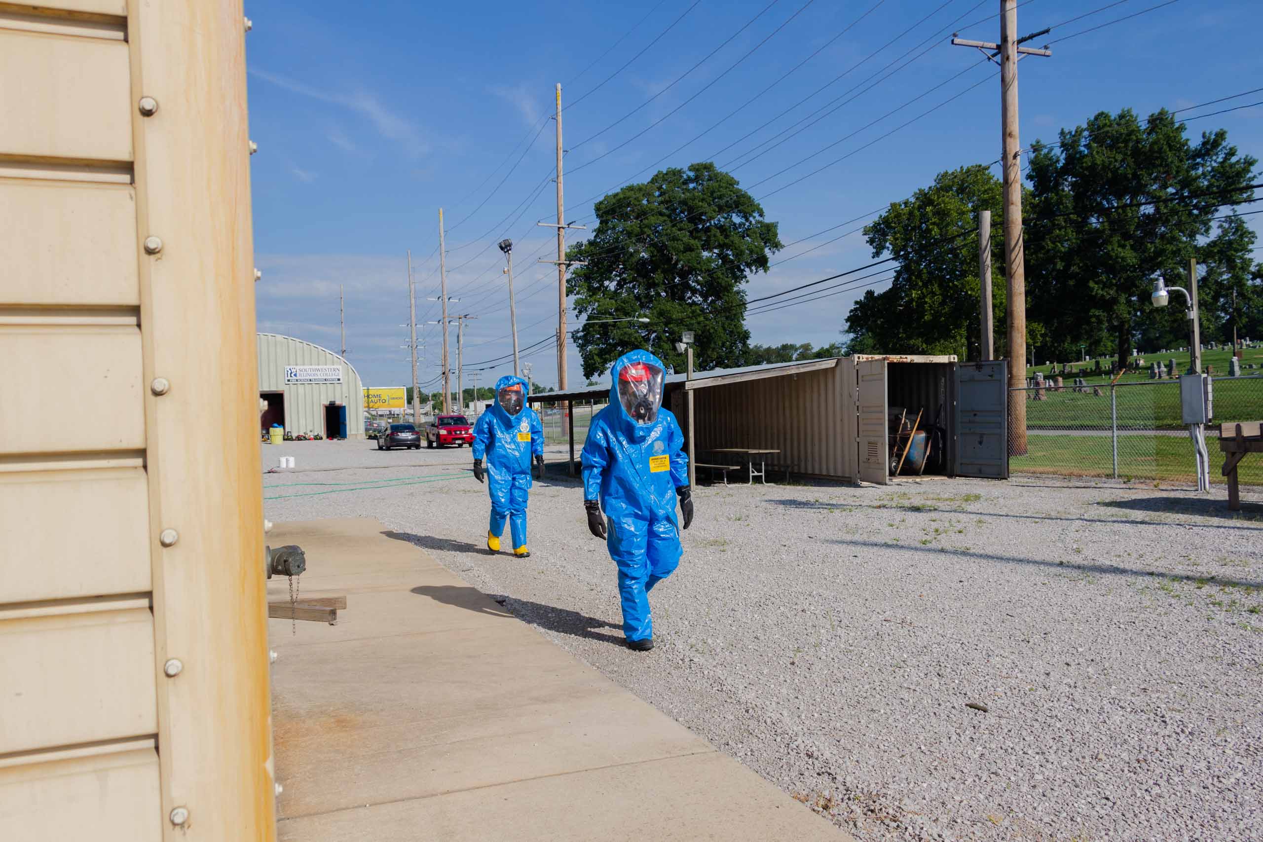 Fire Science Hazard Materials training people in hazmat suits