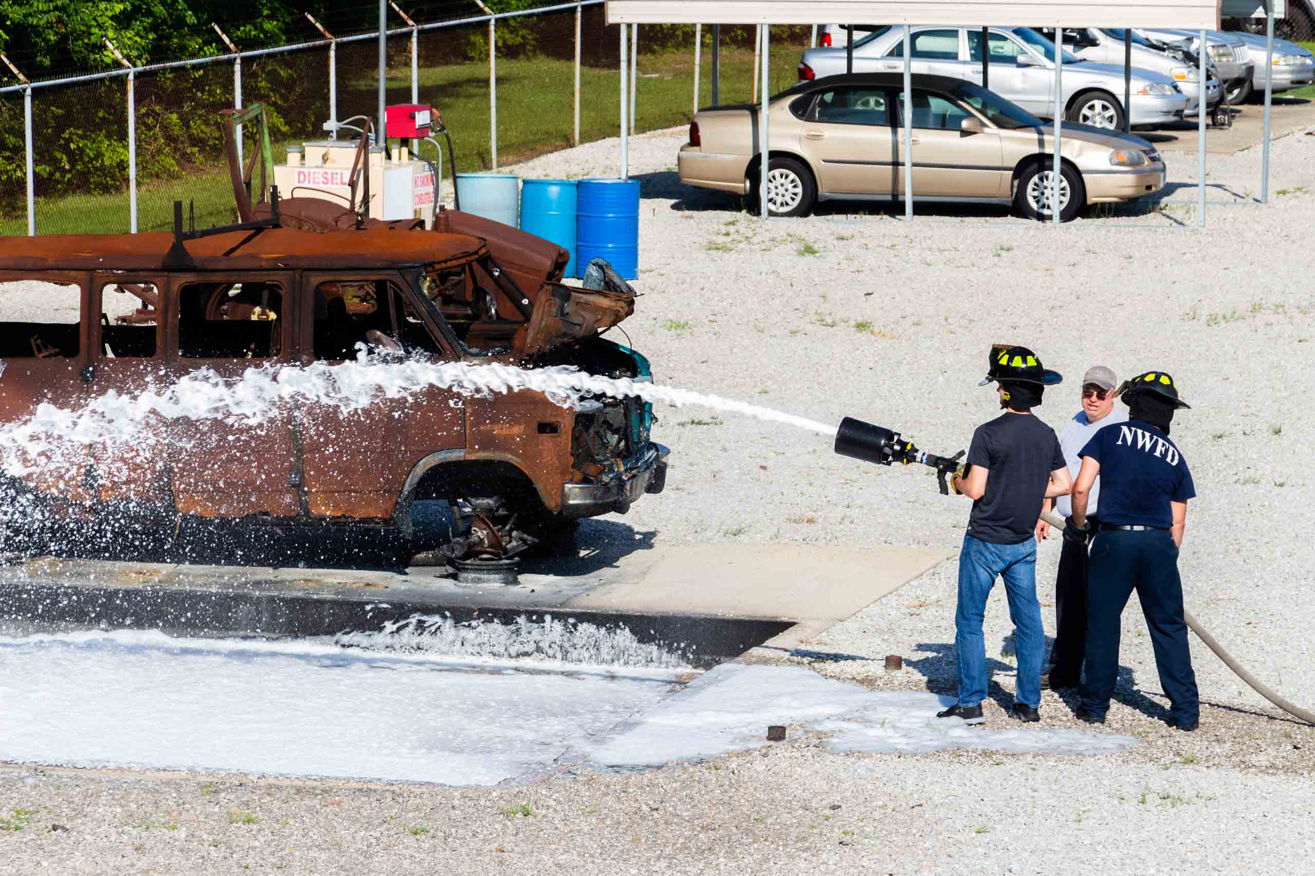 Fire Science Hazardous Materials training people learning to use the hose