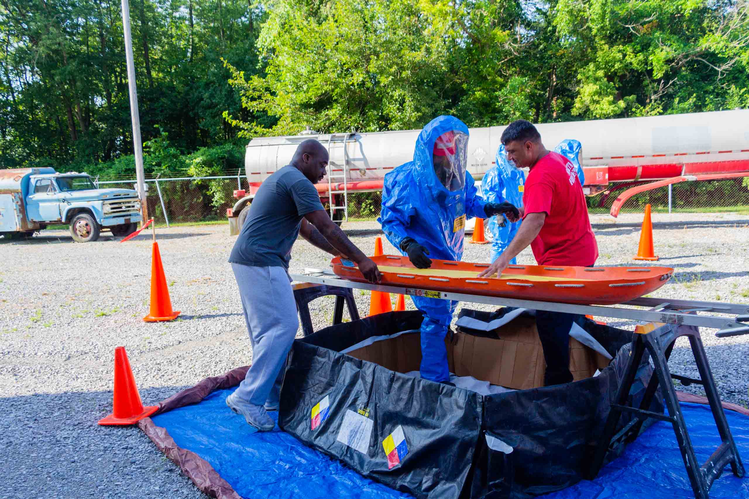 Fire Science Hazardous Materials training person geared up and learning different tasks