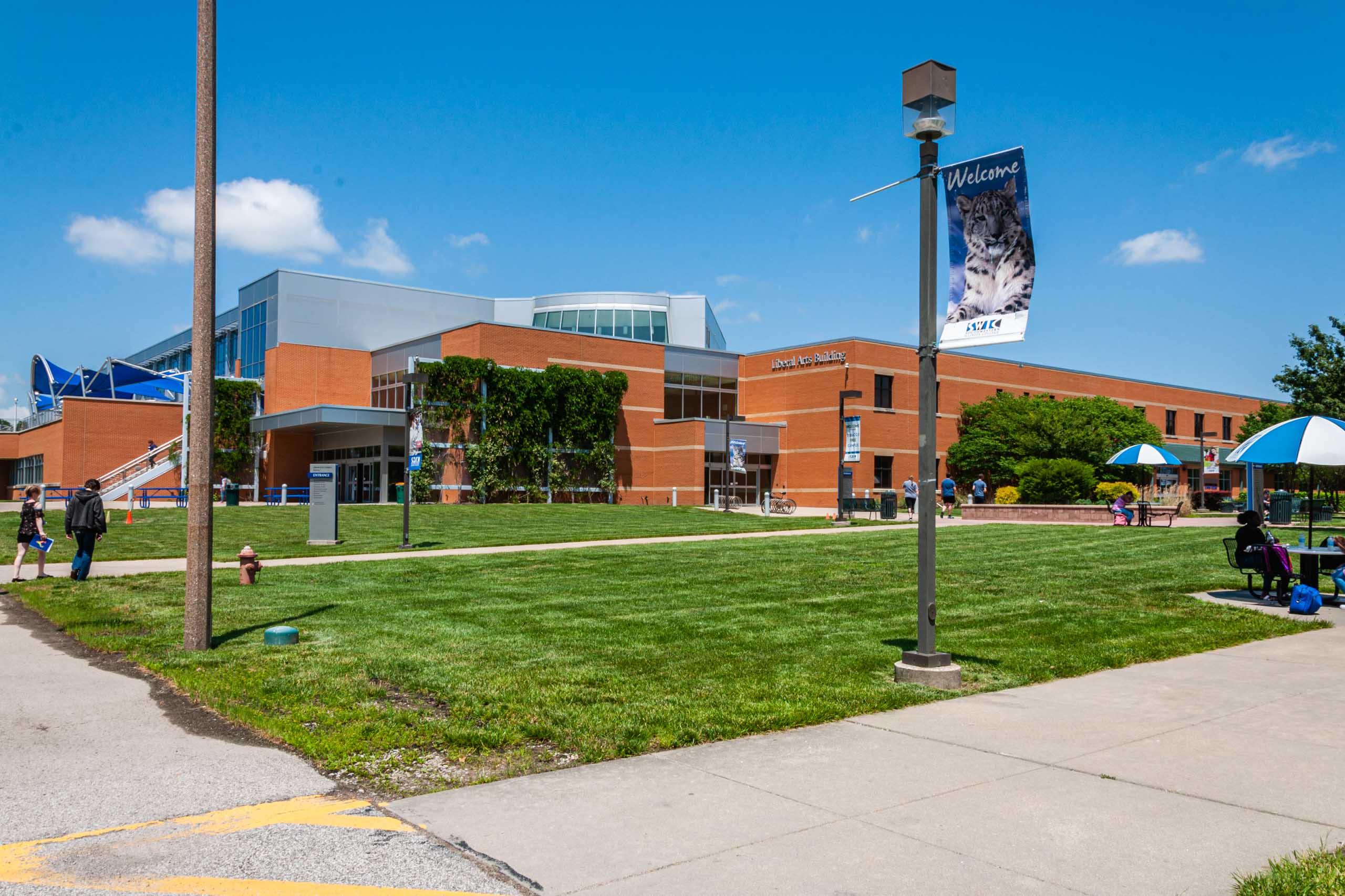 The Liberal Arts building and students hanging out around it during Welcome Week