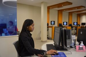 Student at computer station in Financial Aid Office