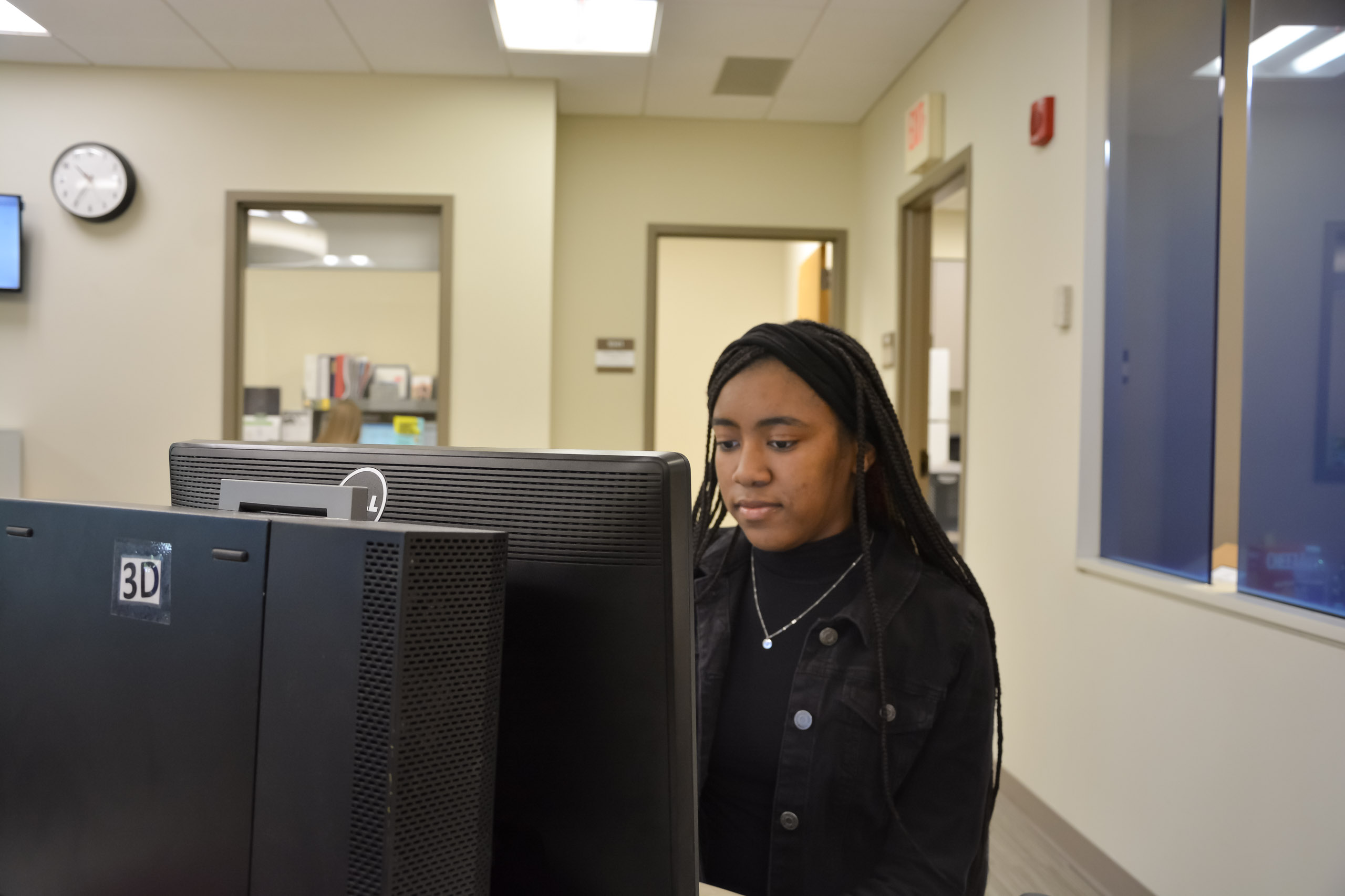 Student at computer station in Financial Aid Office using IRS Data Retrieval Tool