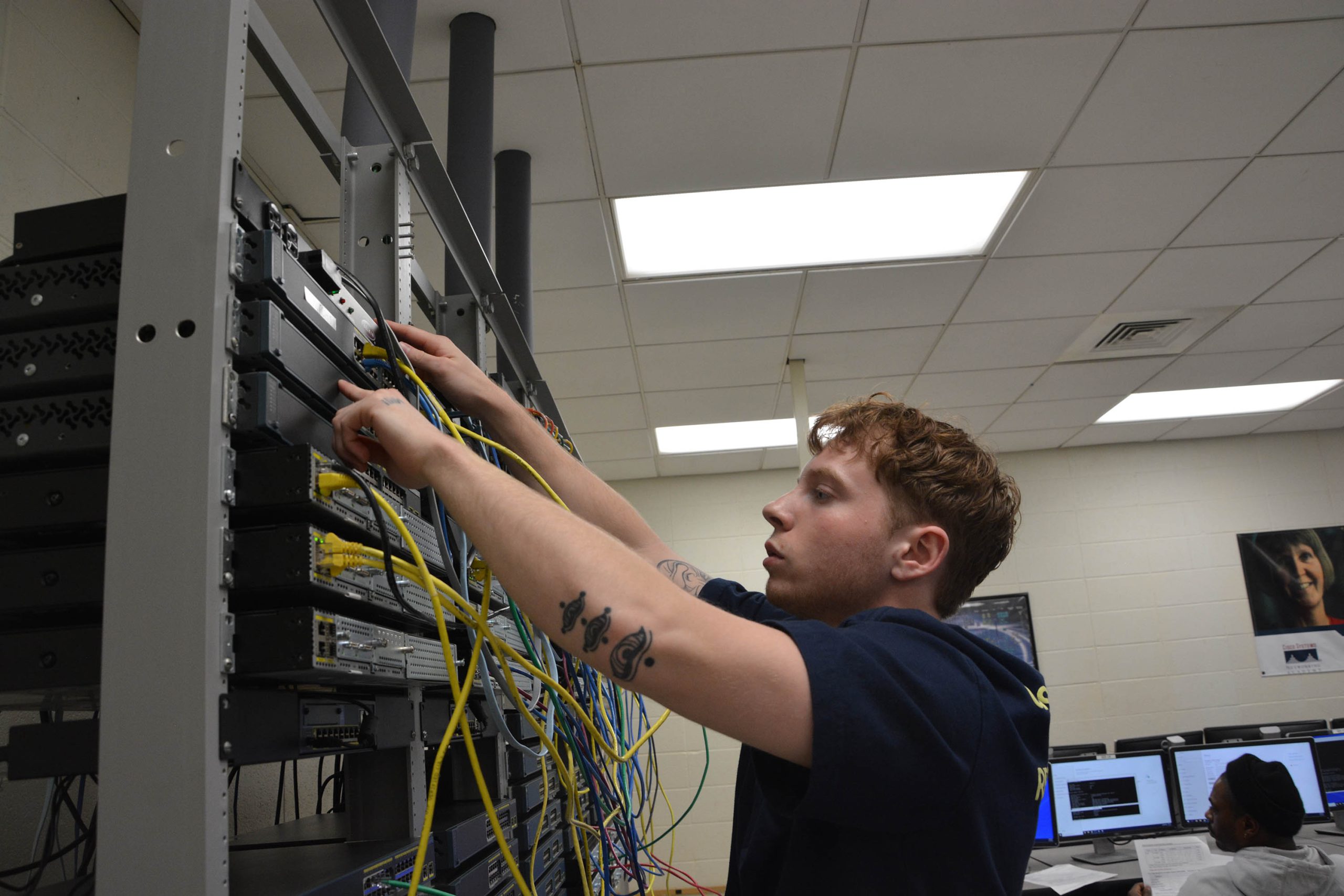 Cybersecurity and Networking Student in classroom